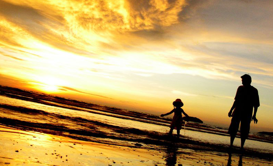 Father and Daughter at the Beach for Vacation