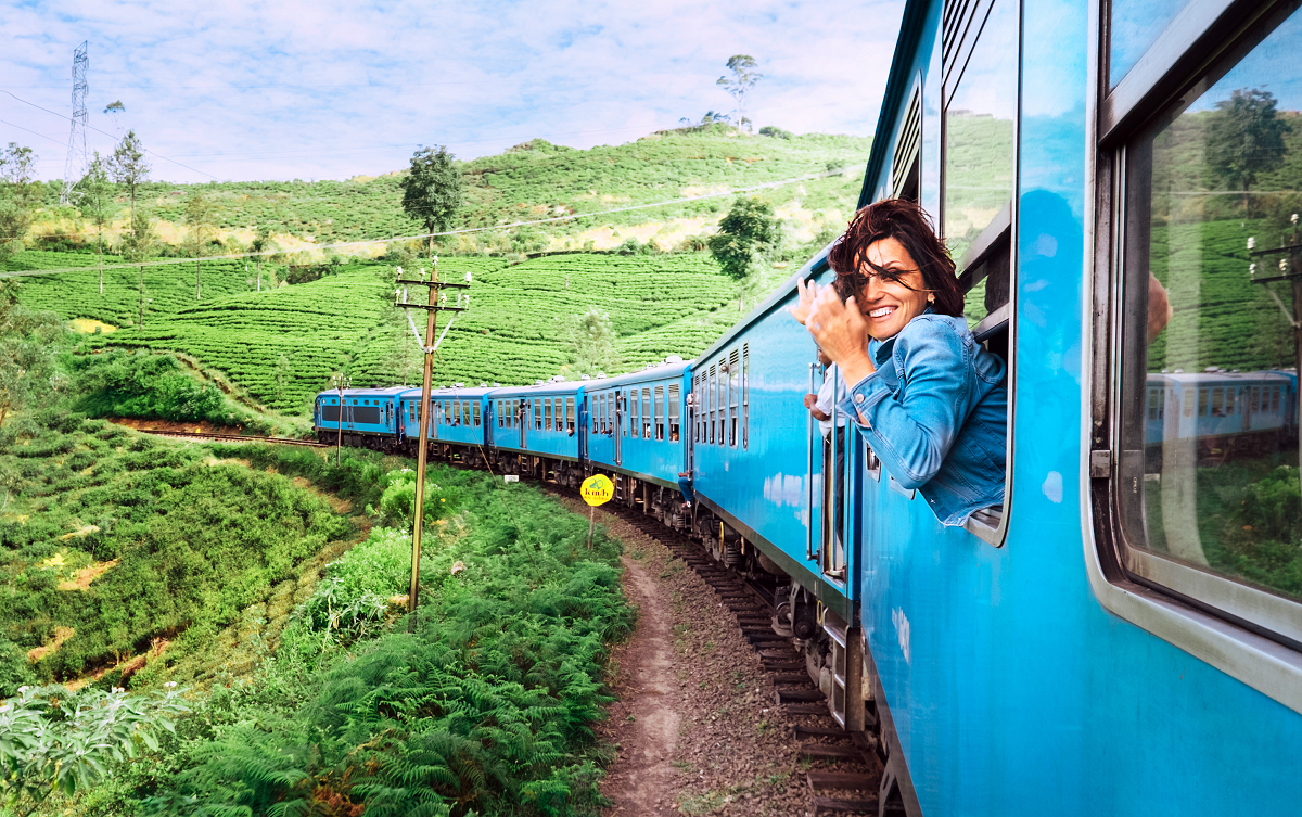 Woman in train smiling